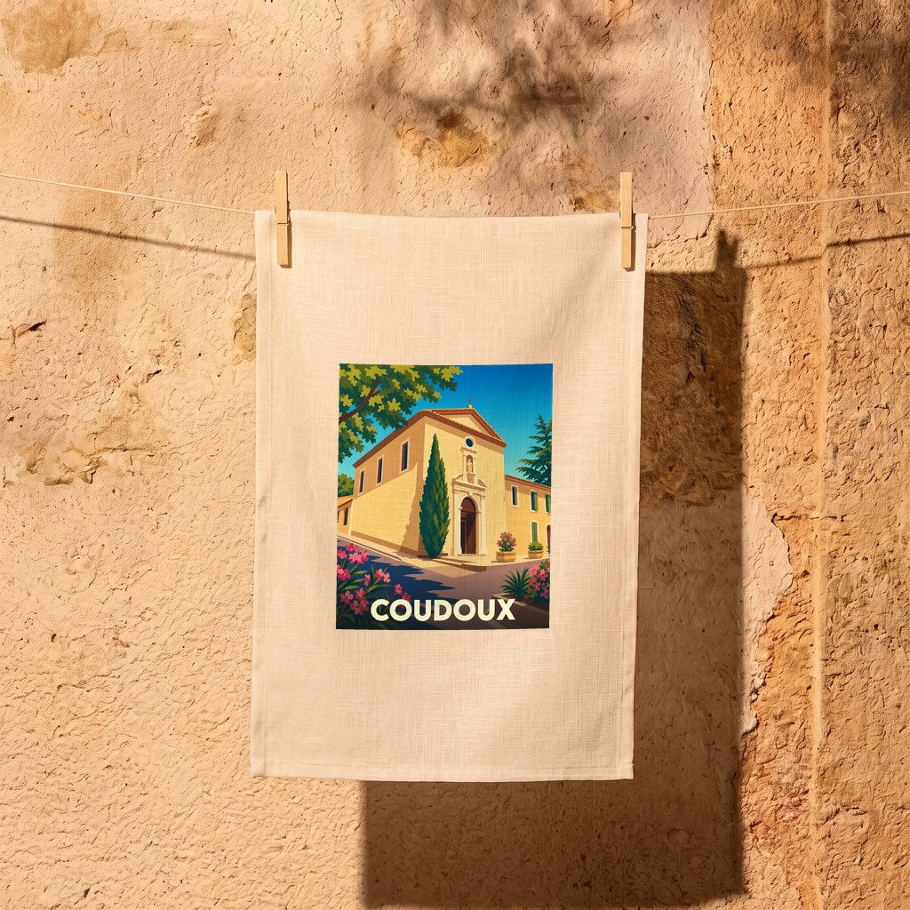 Torchon souvenir de la ville de Coudoux avec une illustration stylisée de son architecture provençale sous un ciel bleu.
