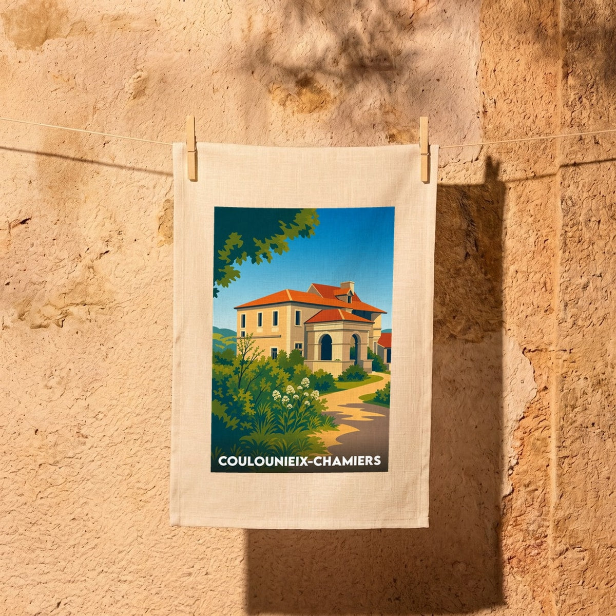 Torchon souvenir de la ville de Coulounieix-Chamiers avec une illustration stylisée de son patrimoine.