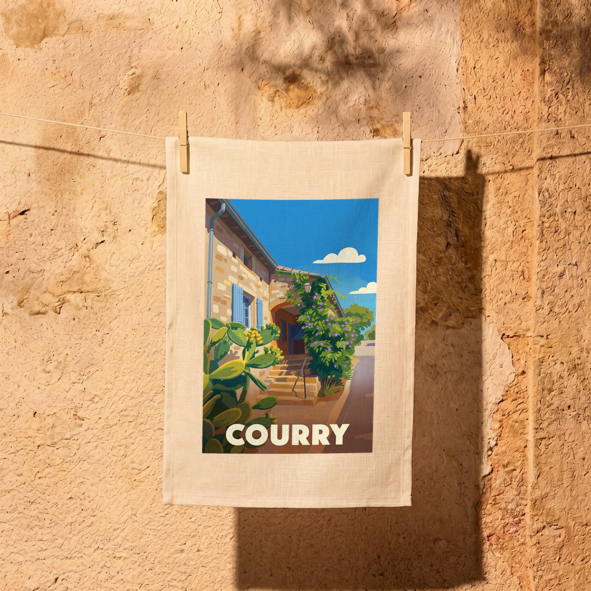 Torchon souvenir de la ville de Courry avec une illustration stylisée.