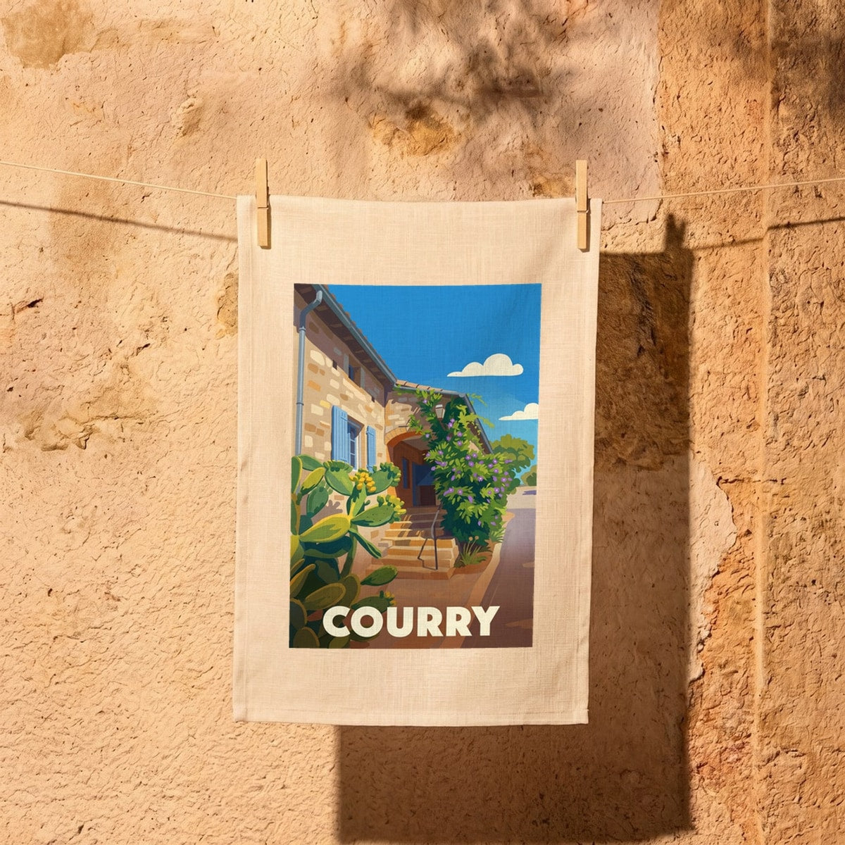 Torchon souvenir de la ville de Courry avec une illustration stylisée.