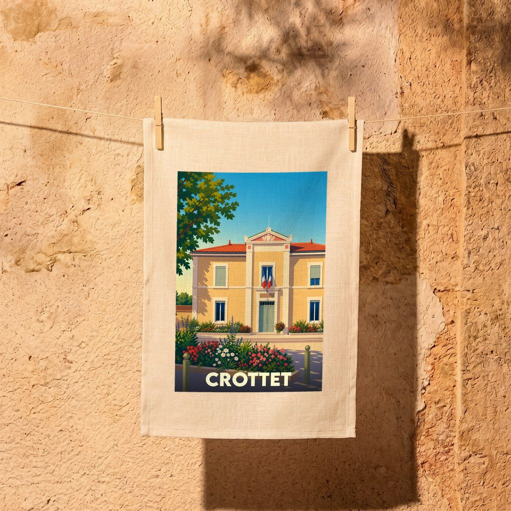 Torchon souvenir de la ville de Crottet avec une illustration stylisée de sa mairie.