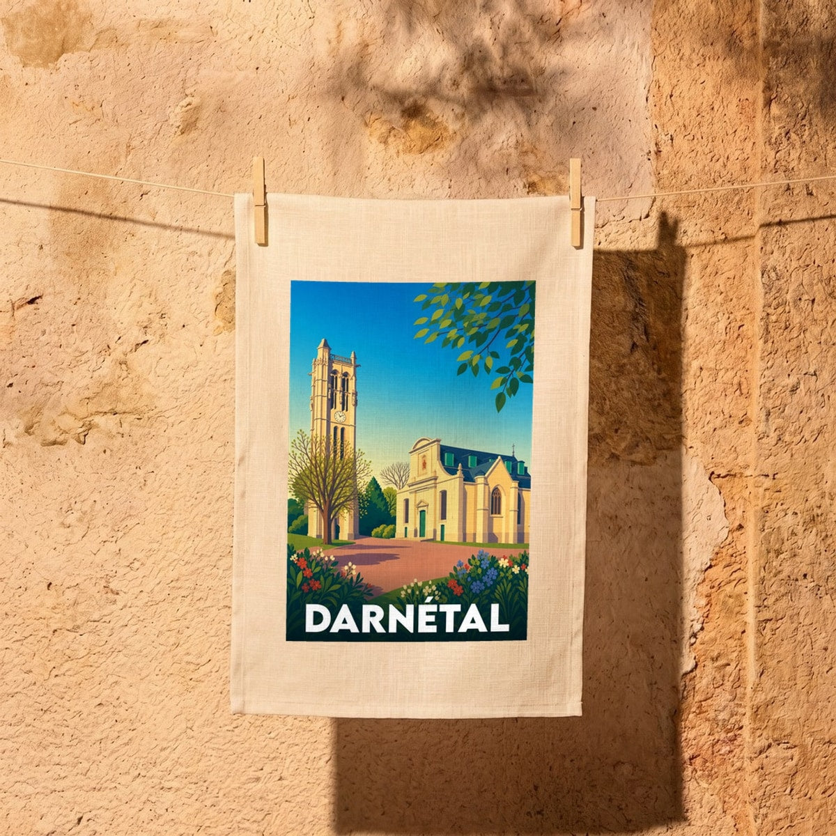 Torchon souvenir de la ville de Darnétal avec une illustration stylisée de son patrimoine architectural.