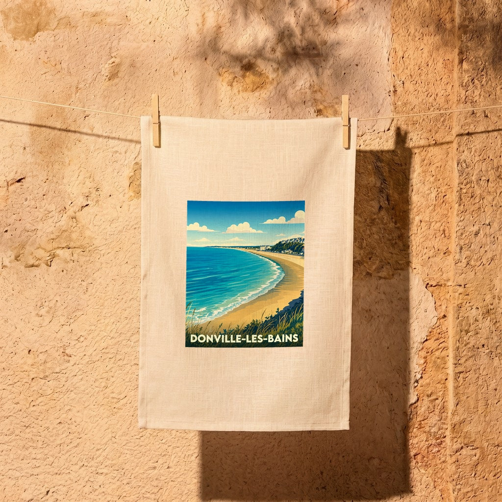 Torchon souvenir de la ville de Donville-les-Bains avec une illustration stylisée de sa plage.