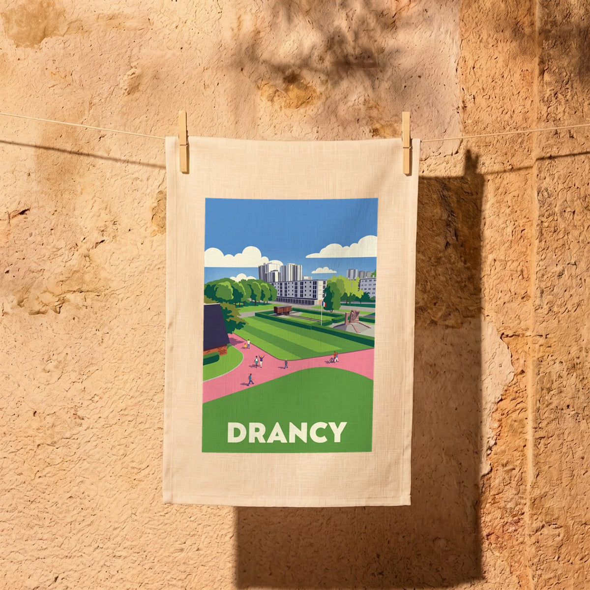 Torchon souvenir de la ville de Drancy avec une illustration stylisée de son paysage urbain.