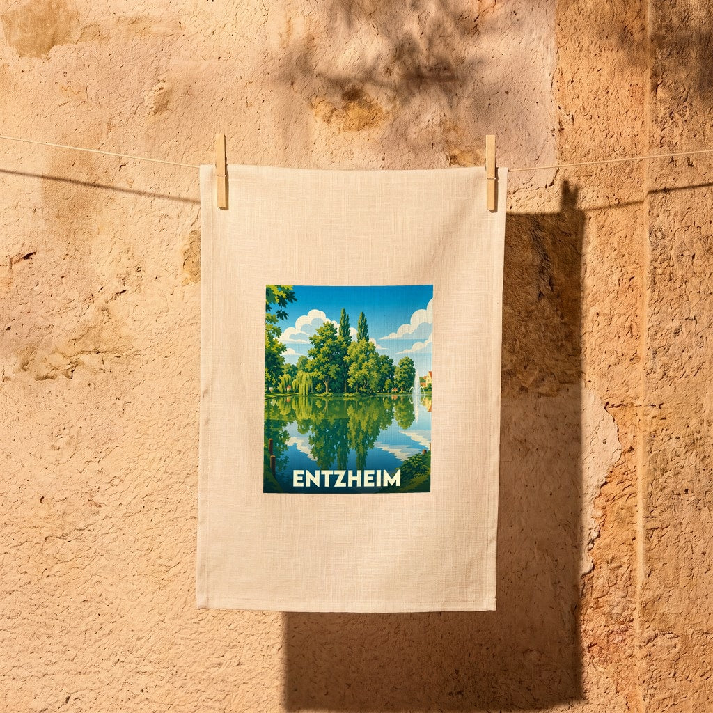 Torchon souvenir de la ville d'Entzheim avec une illustration stylisée d'un plan d'eau arboré.