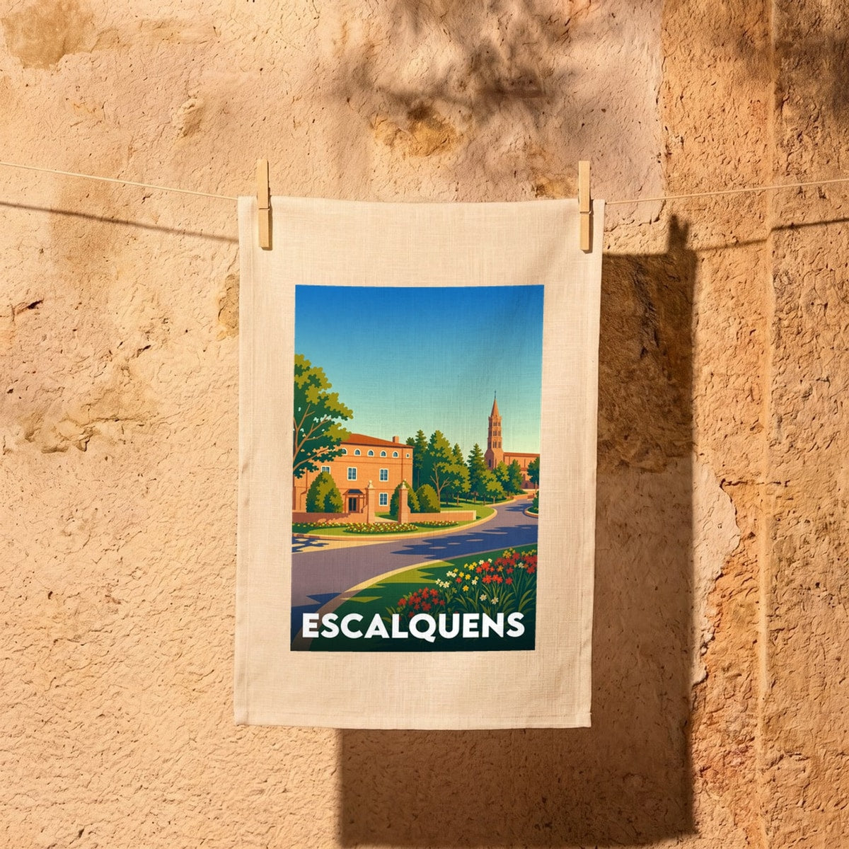 Torchon souvenir de la ville de Escalquens avec une illustration colorée et stylisée de son paysage urbain.