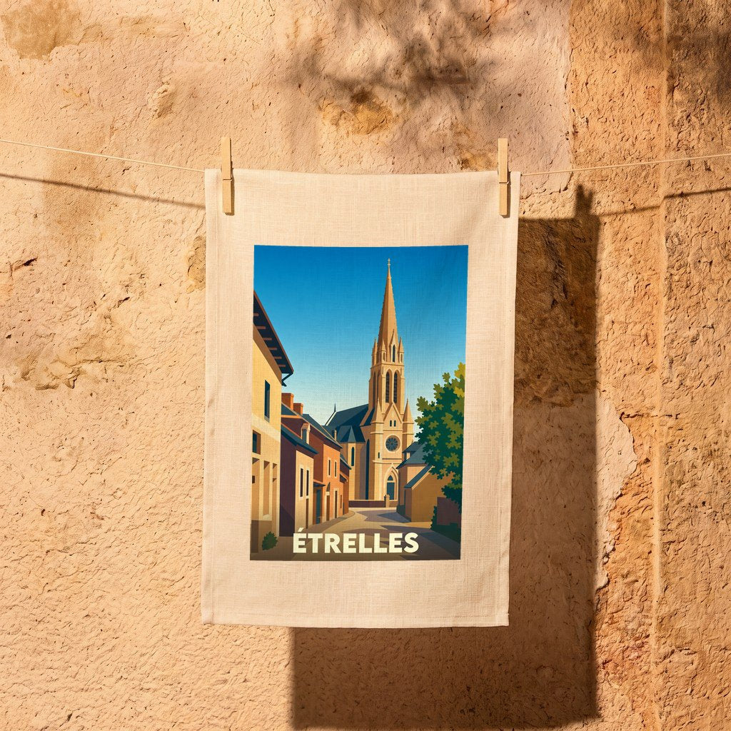 Torchon souvenir de la ville d'Étrelles illustré d'un paysage urbain stylisé avec son église.