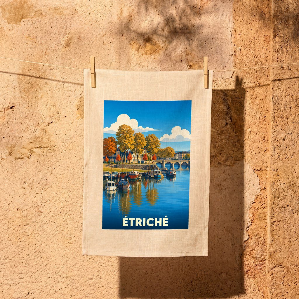 Torchon souvenir de la ville d'Étriché orné d'une illustration stylisée de son port fluvial.