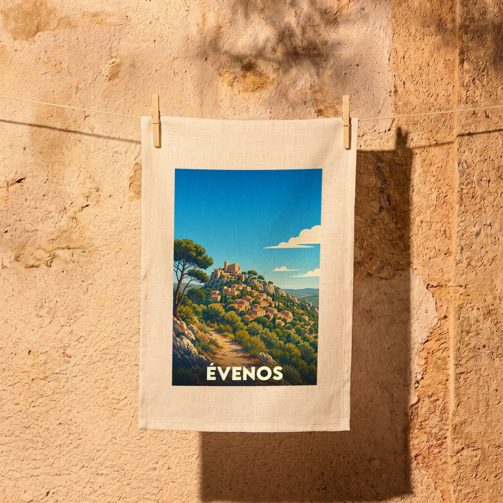 Torchon souvenir de la ville d'Évenos avec une illustration stylisée d'un village perché.