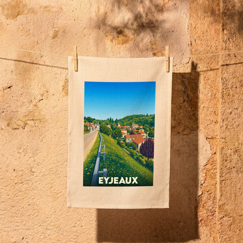 Torchon souvenir de la ville d'Eyjeaux illustré d'un paysage de campagne coloré et stylisé.