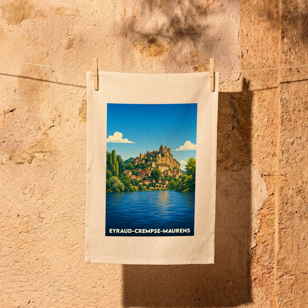 Torchon souvenir de la ville de Eyraud-Crempse-Maurens avec une illustration stylisée d'un village perché au bord de l'eau.