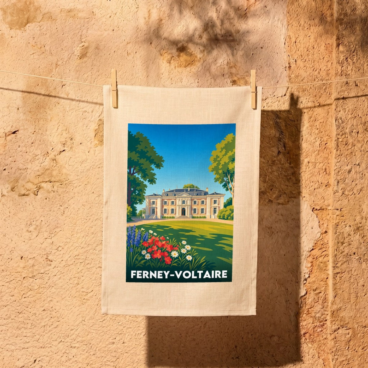 Torchon souvenir de la ville de Ferney-Voltaire avec une illustration stylisée de son château.