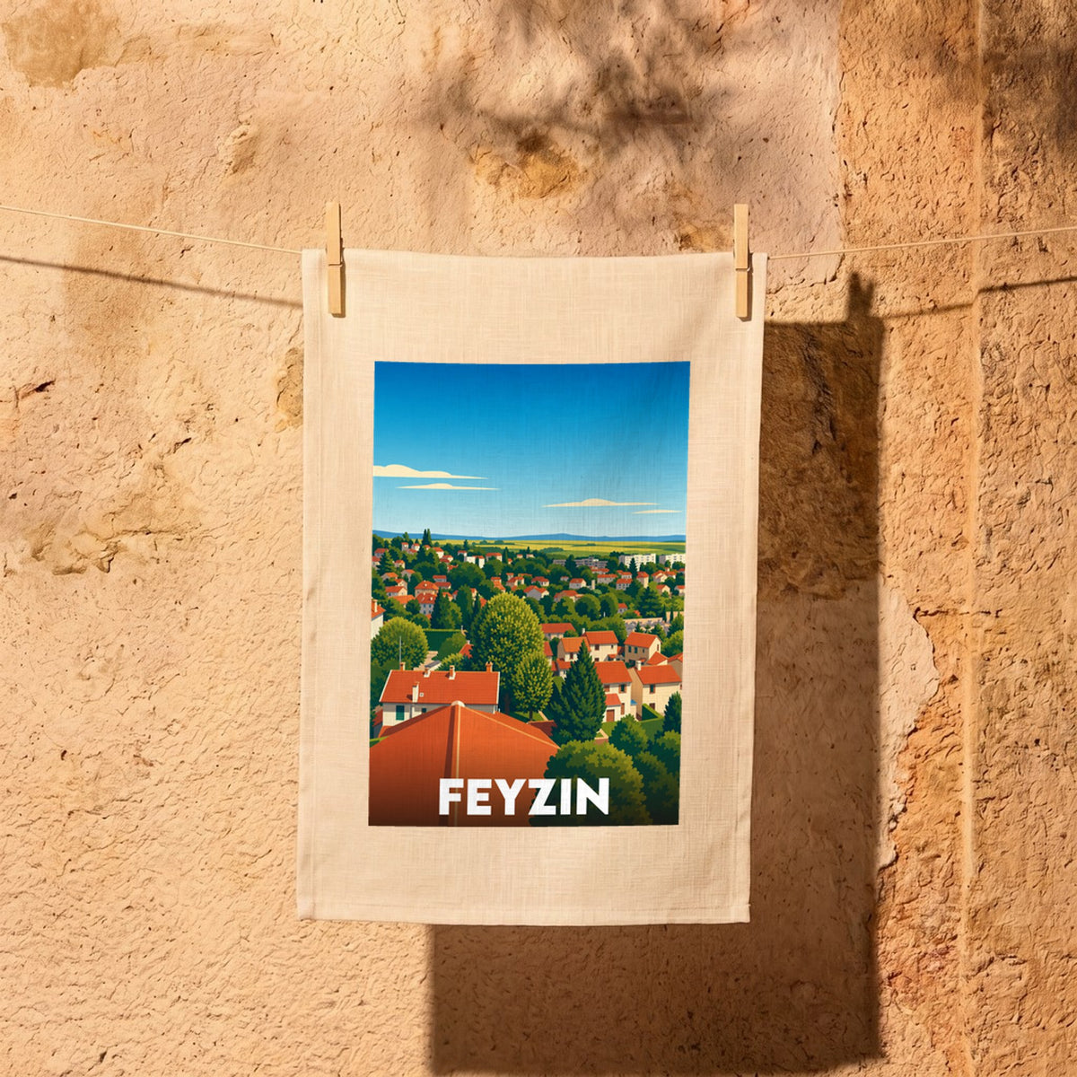 Torchon souvenir de la ville de Feyzin avec une illustration stylisée et colorée de ses paysages.