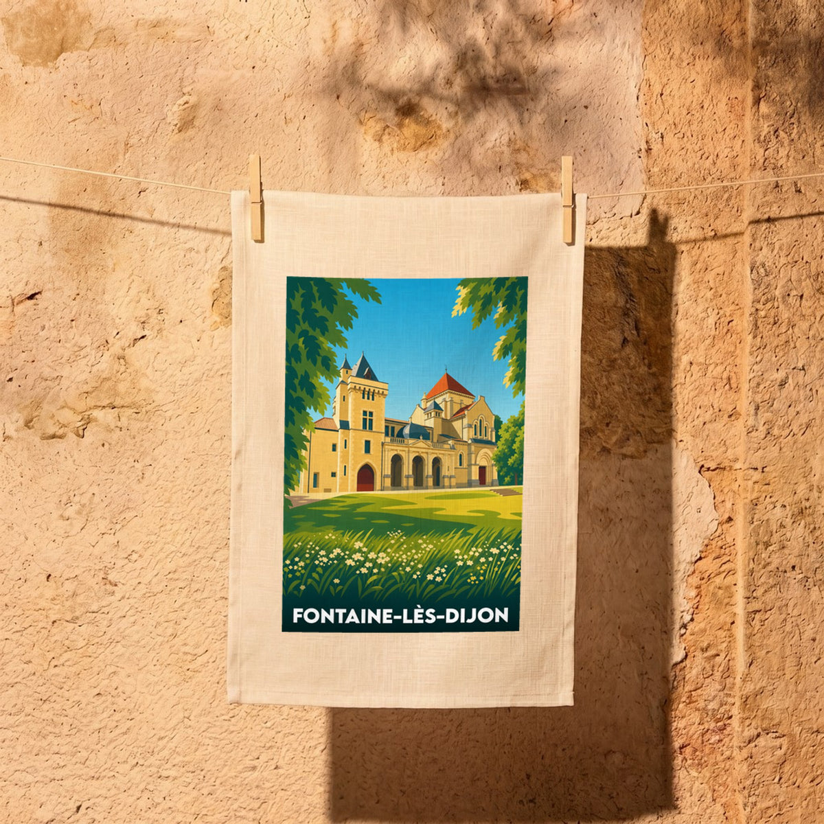 Torchon souvenir de Fontaine-lès-Dijon orné d'une illustration stylisée du château et de l'église Saint-Bernard.