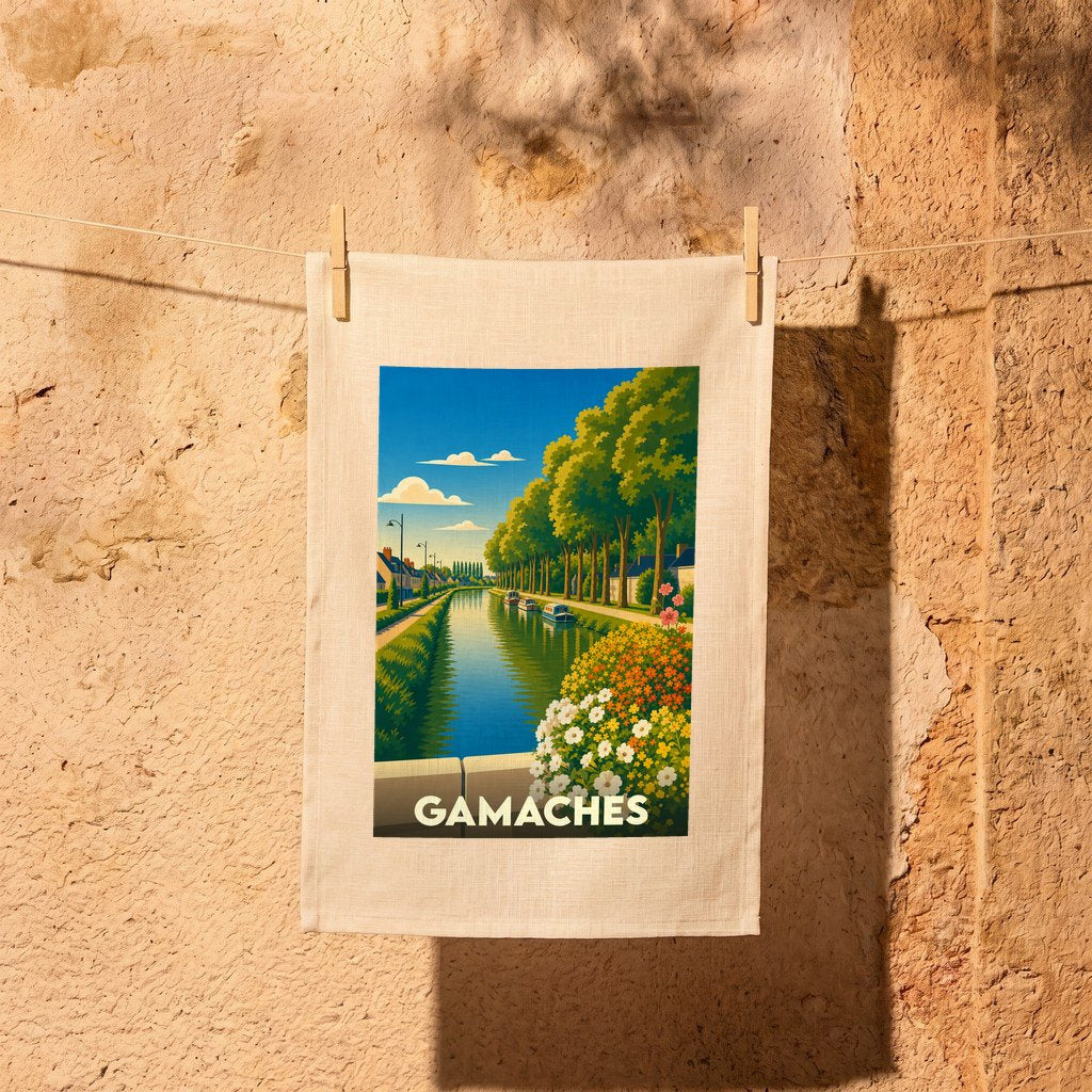 Torchon souvenir de la ville de Gamaches orné d'une illustration stylisée de son canal bordé d'arbres.