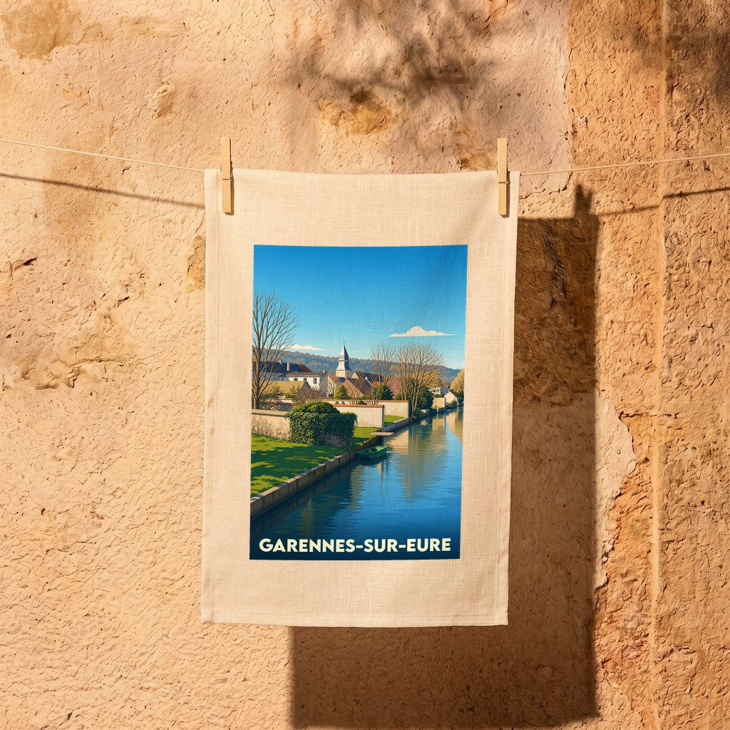 Torchon souvenir de la ville de Garennes-sur-Eure avec une illustration stylisée de son canal et de son église.