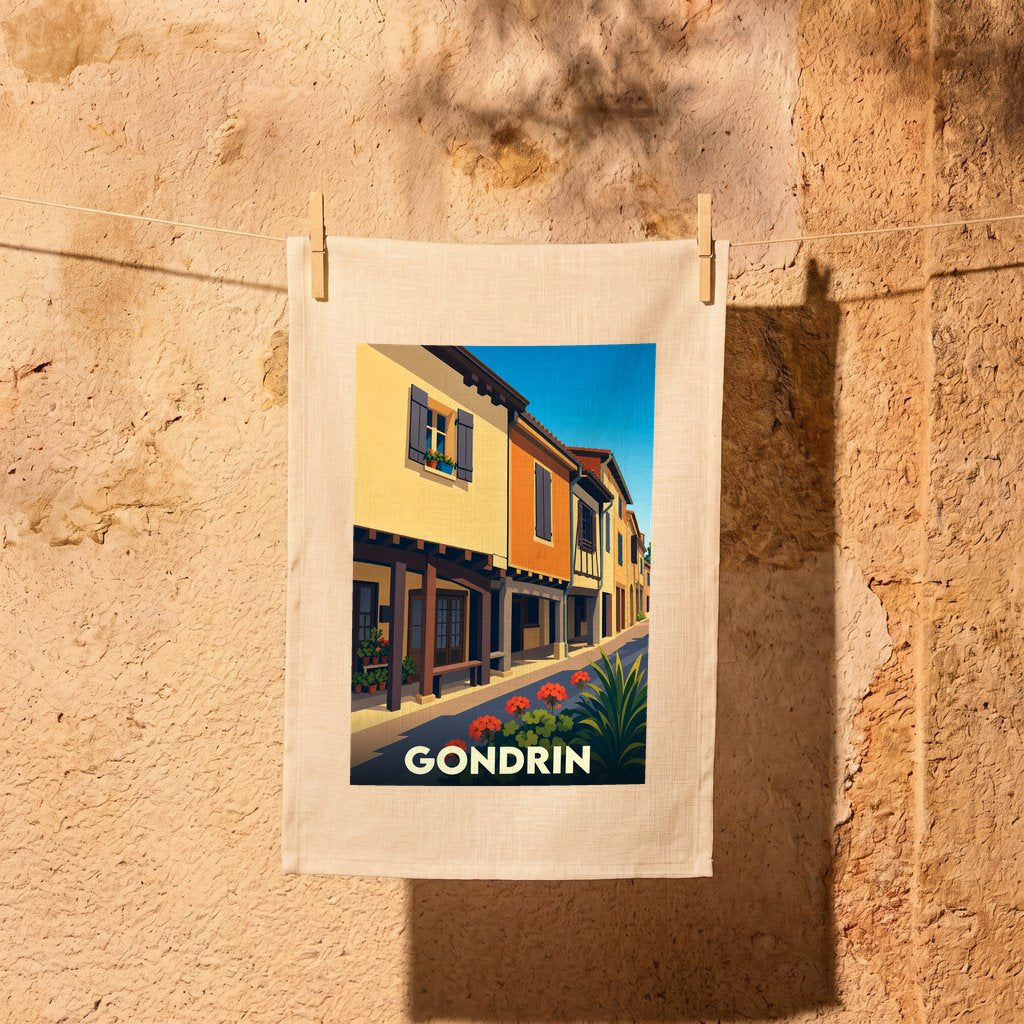 Torchon souvenir de la ville de Gondrin avec une illustration stylisée d'une rue ensoleillée.