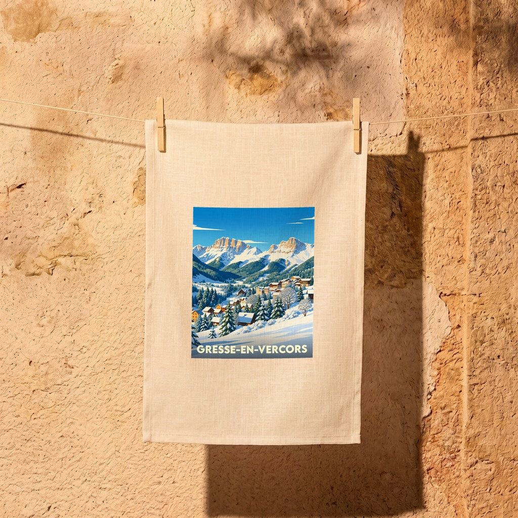 Torchon souvenir de la ville de Gresse-en-Vercors illustré d'un paysage de montagne enneigé.