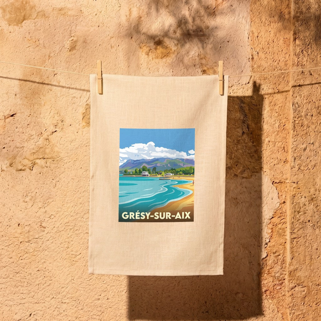 Torchon souvenir de la ville de Grésy-sur-Aix avec une illustration stylisée d'un paysage de lac et de montagnes.