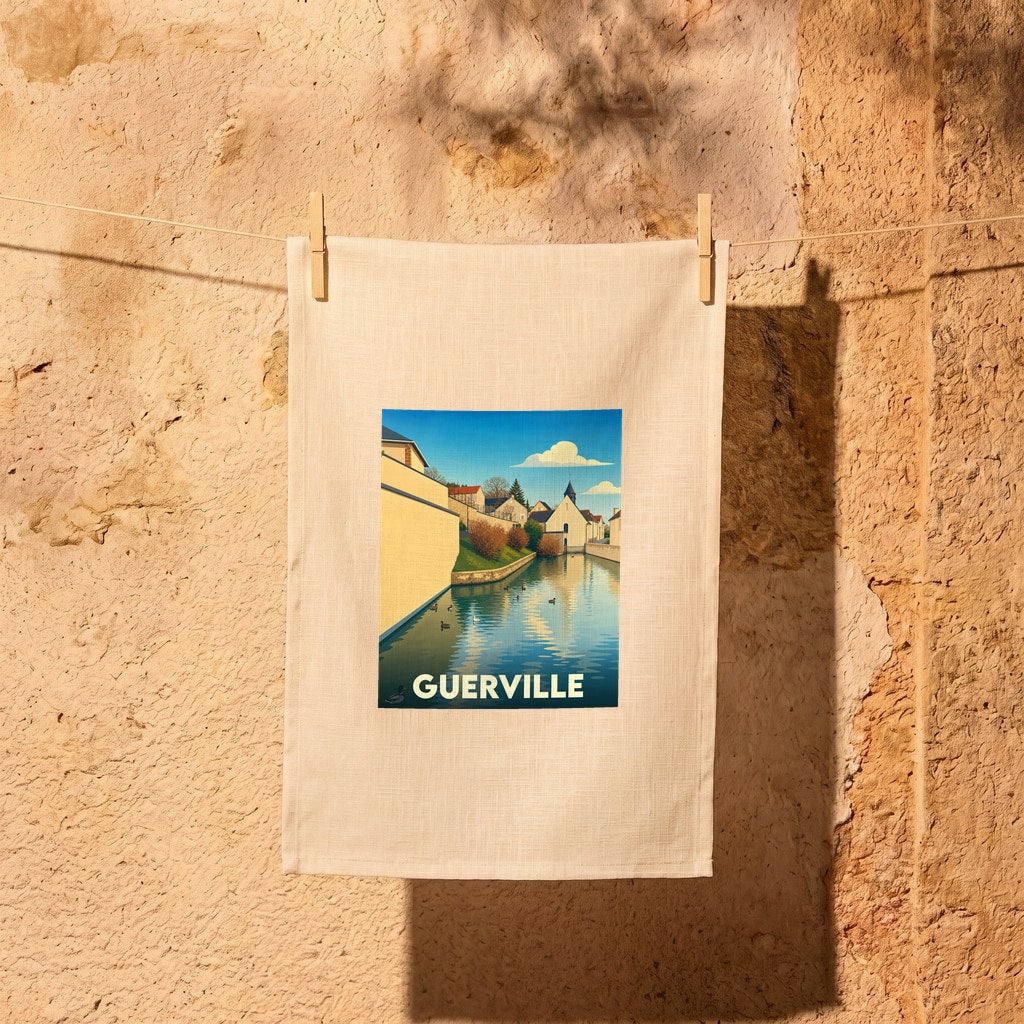 Torchon souvenir de la ville de Guerville avec une illustration stylisée de son canal et de ses bâtiments.