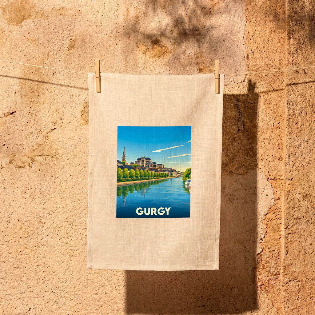 Torchon souvenir de la ville de Gurgy illustré d'un paysage urbain au bord de l'eau.