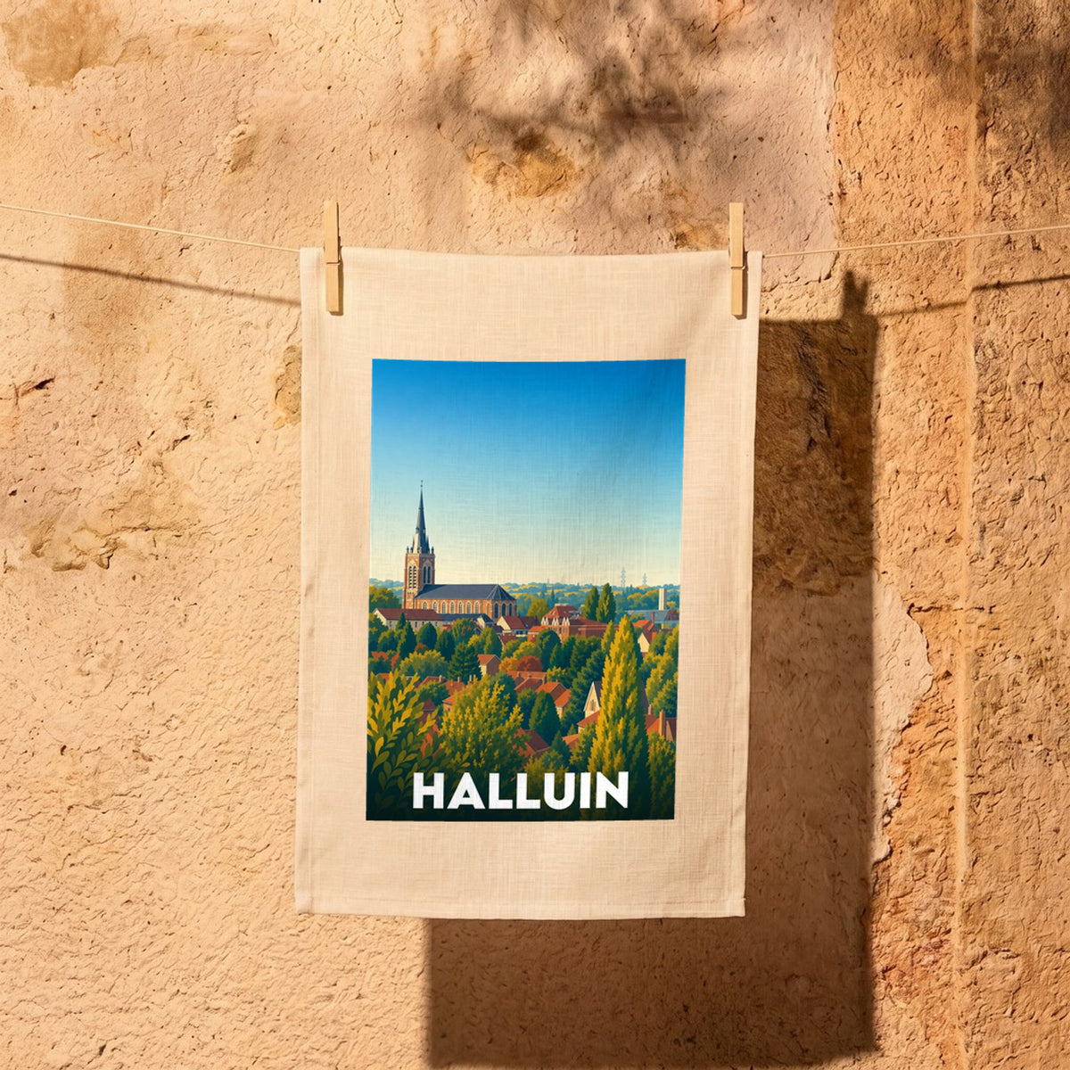 Torchon souvenir de la ville de Halluin avec une illustration stylisée.
