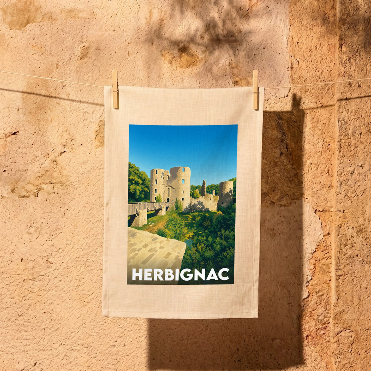 Torchon souvenir de la ville de Herbignac avec une illustration stylisée de son château médiéval.