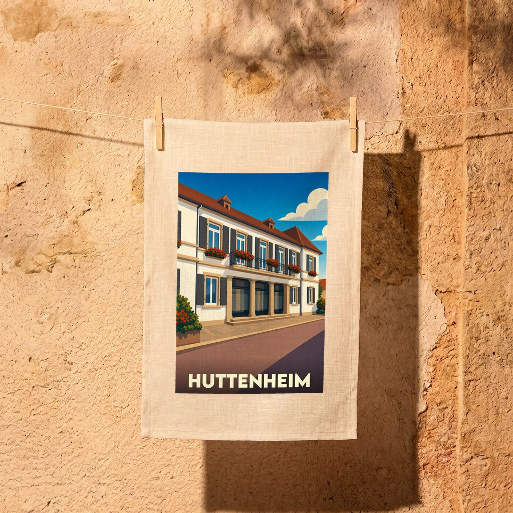 Torchon souvenir de la ville de Huttenheim avec une illustration stylisée d'un bâtiment alsacien.