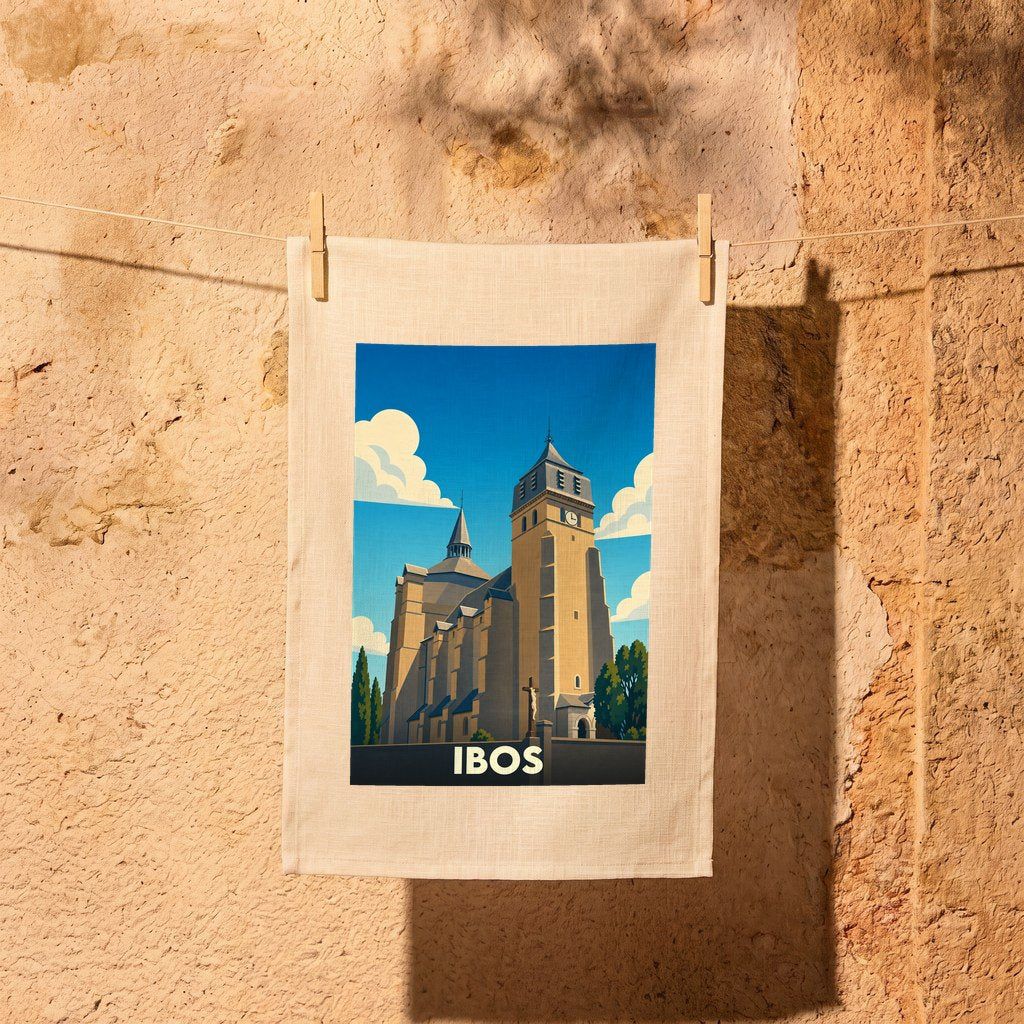 Torchon souvenir de la ville d'Ibos orné d'une illustration stylisée de son église collégiale.
