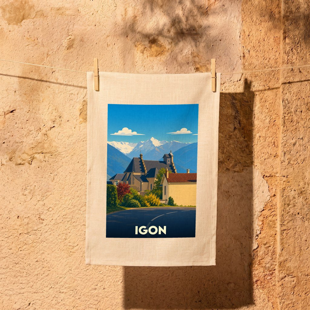 Torchon souvenir de la ville d'Igon orné d'une illustration stylisée de son église face aux Pyrénées.