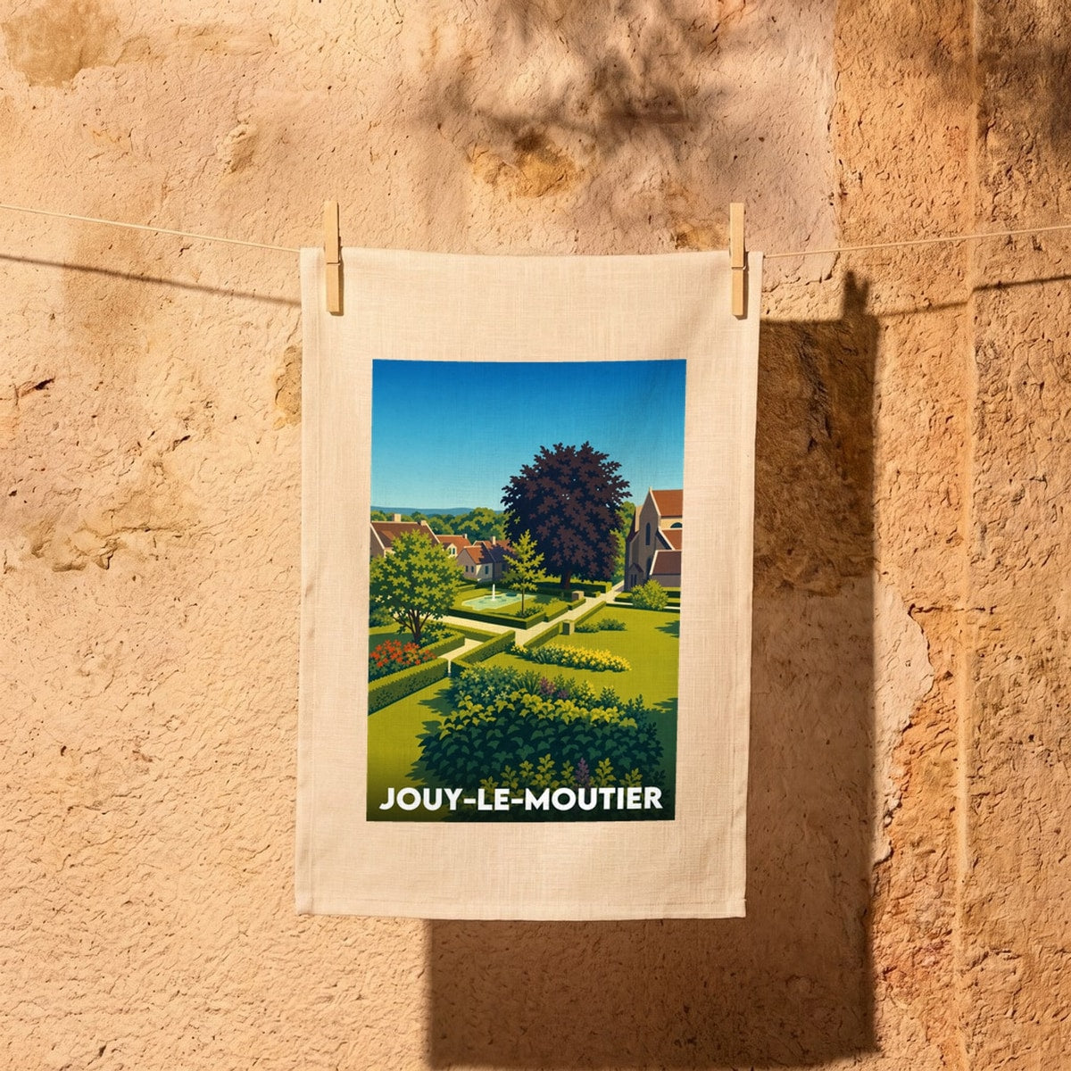 Torchon souvenir de la ville de Jouy-le-Moutier avec une illustration stylisée.