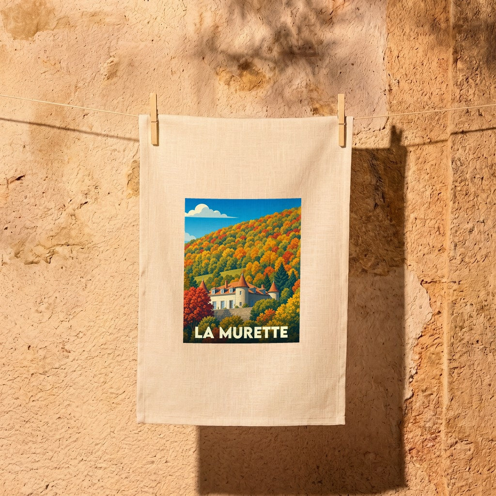Torchon souvenir de la ville de La Murette avec une illustration stylisée d'un château entouré de collines automnales.