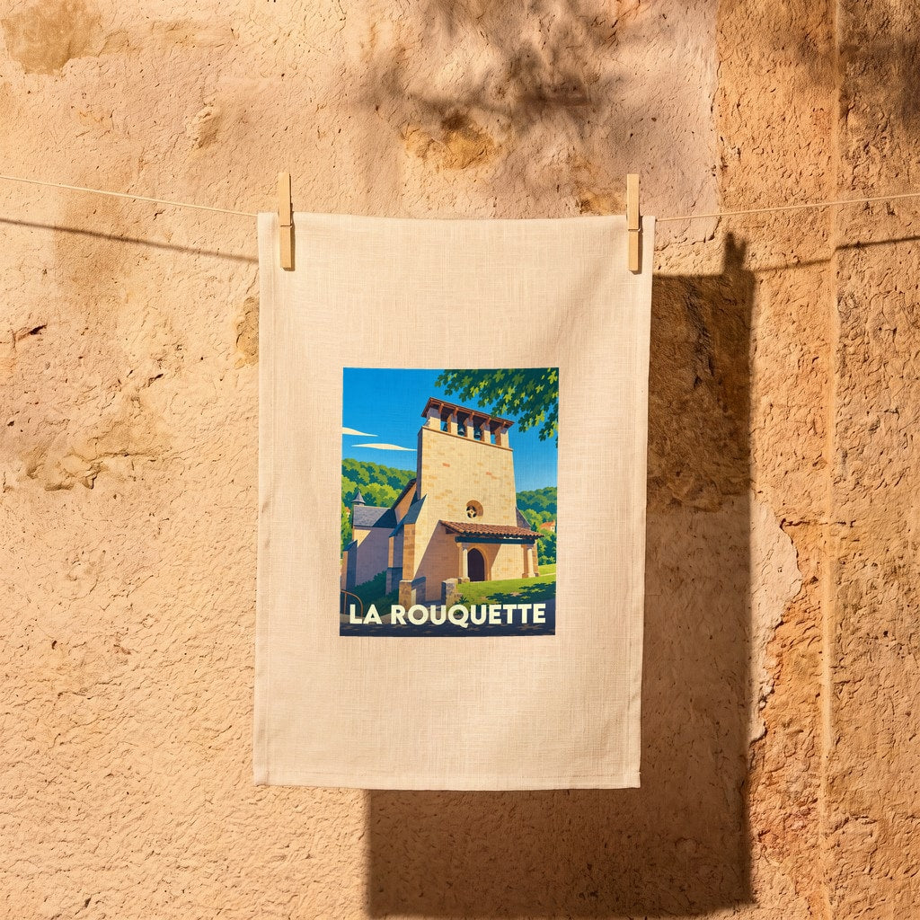 Torchon souvenir de la ville de La Rouquette avec une illustration stylisée.