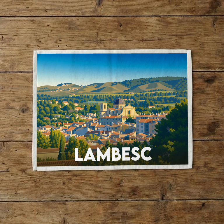 Torchon souvenir de la ville de Lambesc avec une illustration stylisée du village provençal.
