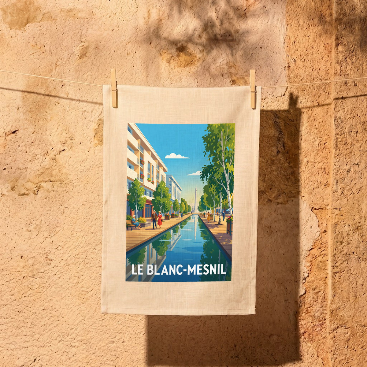 Torchon souvenir de la ville de Le Blanc-Mesnil avec une illustration rétro et colorée.