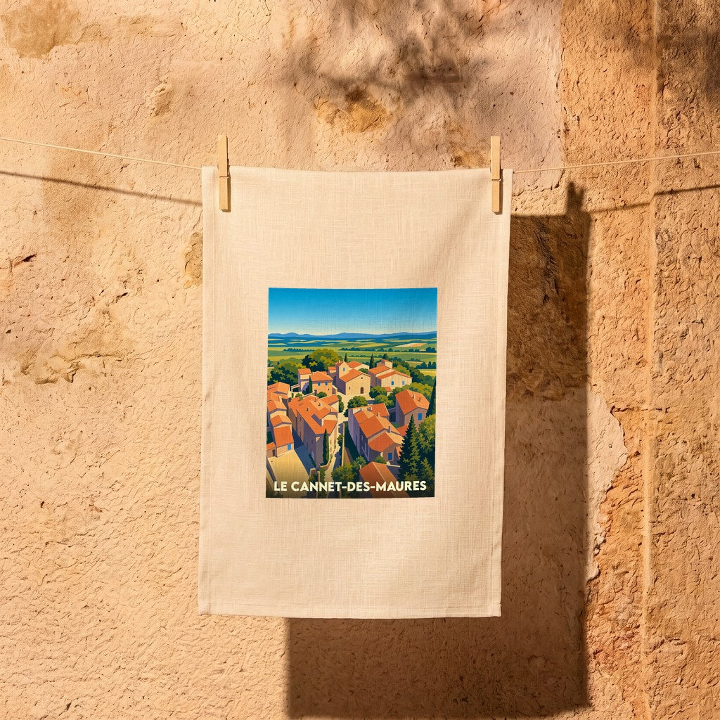 Torchon souvenir de la ville de Le Cannet-des-Maures avec une illustration stylisée.