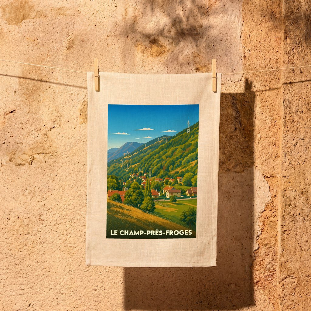 Torchon souvenir de la ville de Le Champ-près-Froges avec une illustration stylisée de son paysage montagneux.