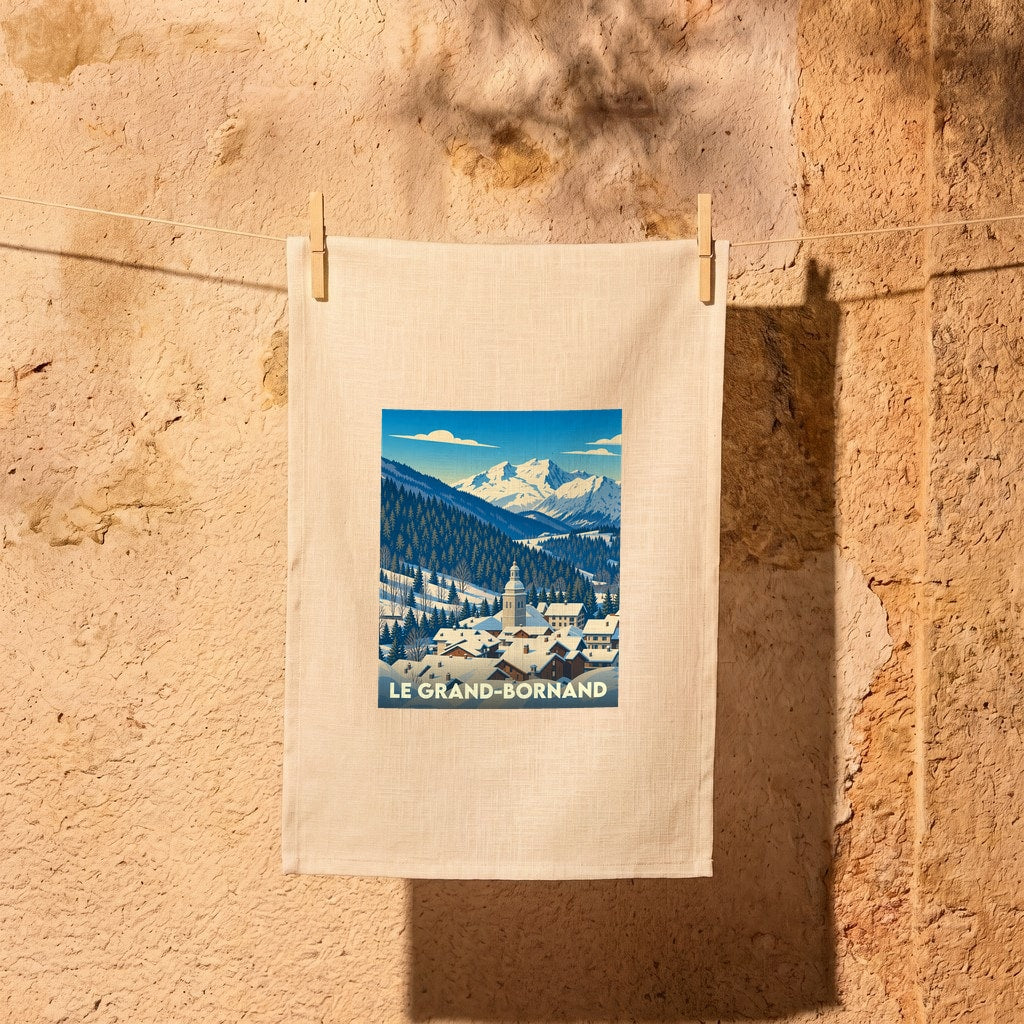 Torchon souvenir de la ville de Le Grand-Bornand avec une illustration stylisée d'un paysage de montagne enneigé.