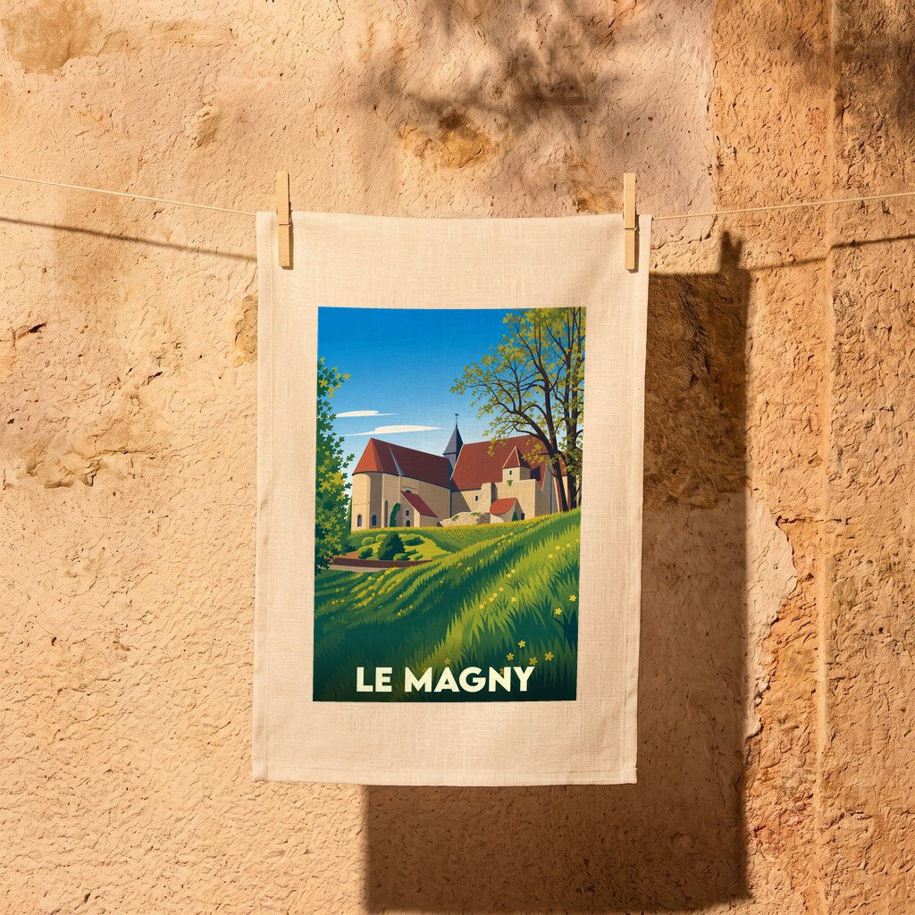Torchon souvenir de la ville de Le Magny avec une illustration stylisée d'un paysage de campagne et de son église.