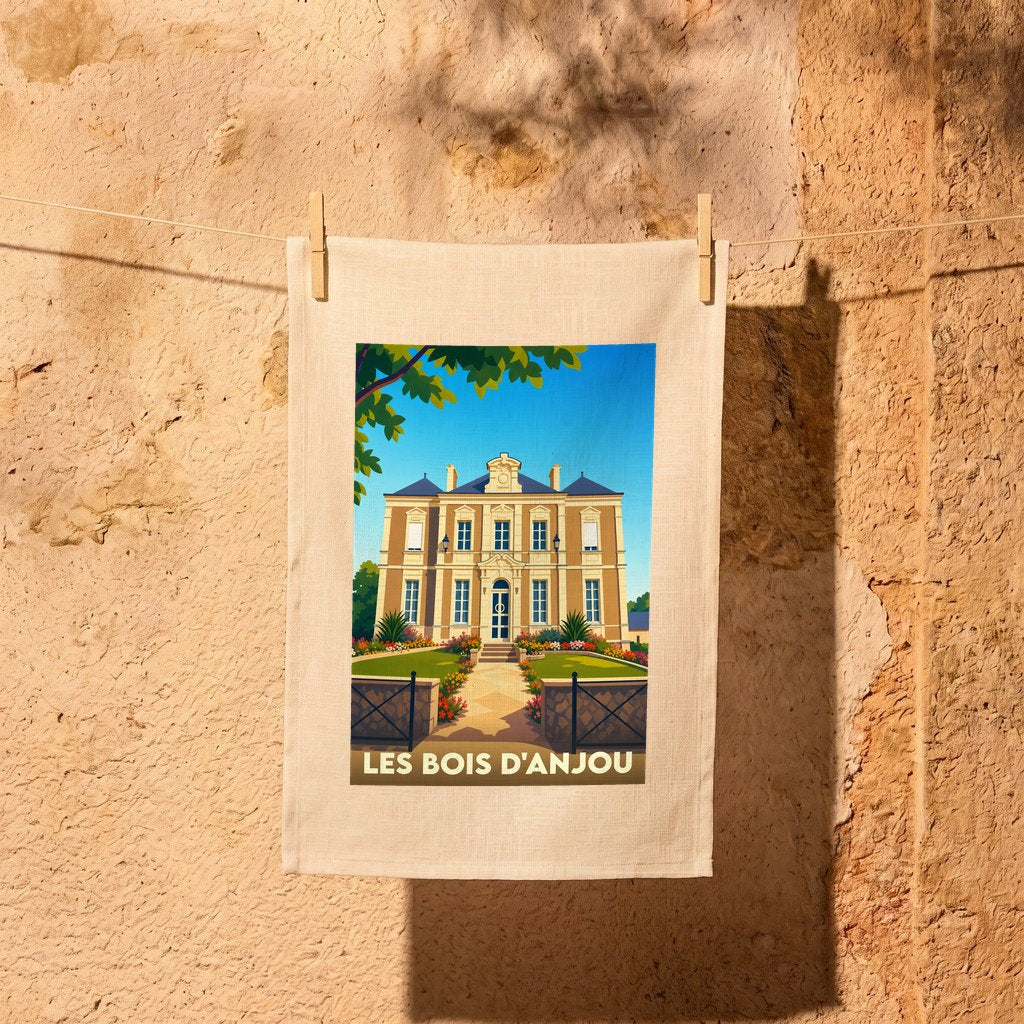 Torchon souvenir de la commune de Les Bois d'Anjou avec une illustration stylisée d'un manoir.