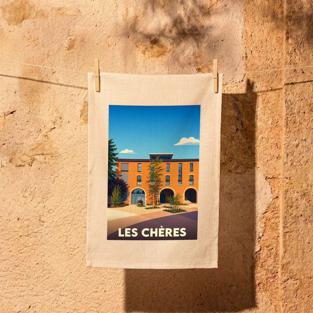 Torchon souvenir de la ville de Les Chères avec une illustration stylisée d'un bâtiment provençal.