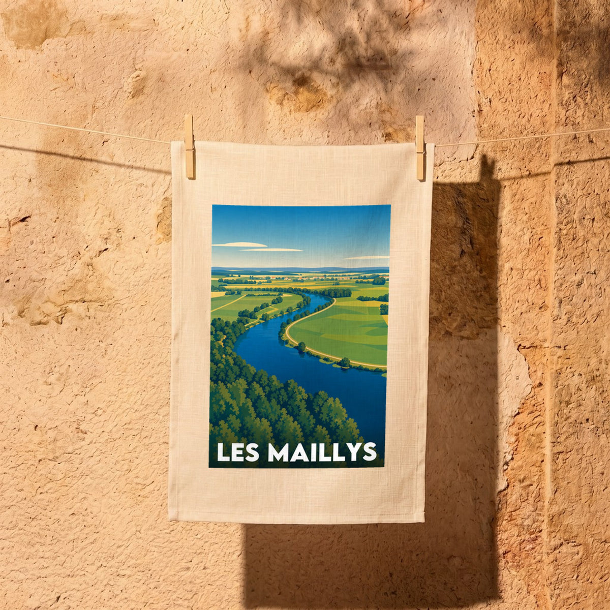 Torchon souvenir de la ville de Les Maillys avec une illustration stylisée.
