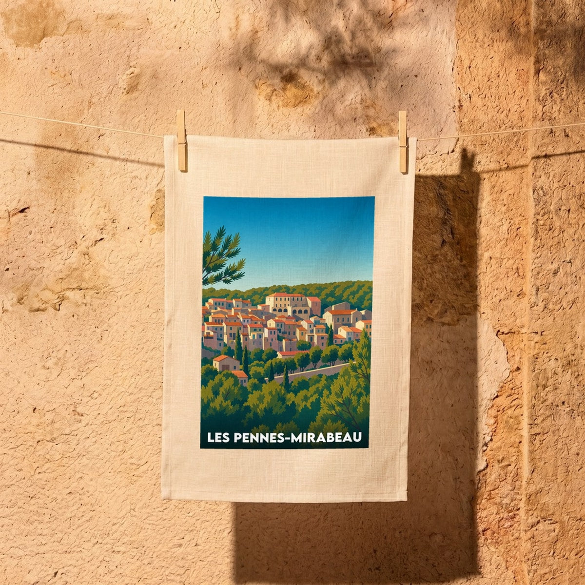 Torchon souvenir de la ville de Les Pennes-Mirabeau avec une illustration stylisée.