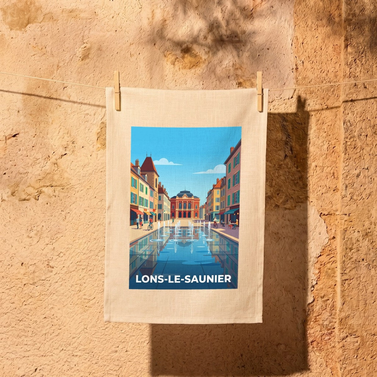 Torchon souvenir de la ville de Lons-le-Saunier avec une illustration stylisée.
