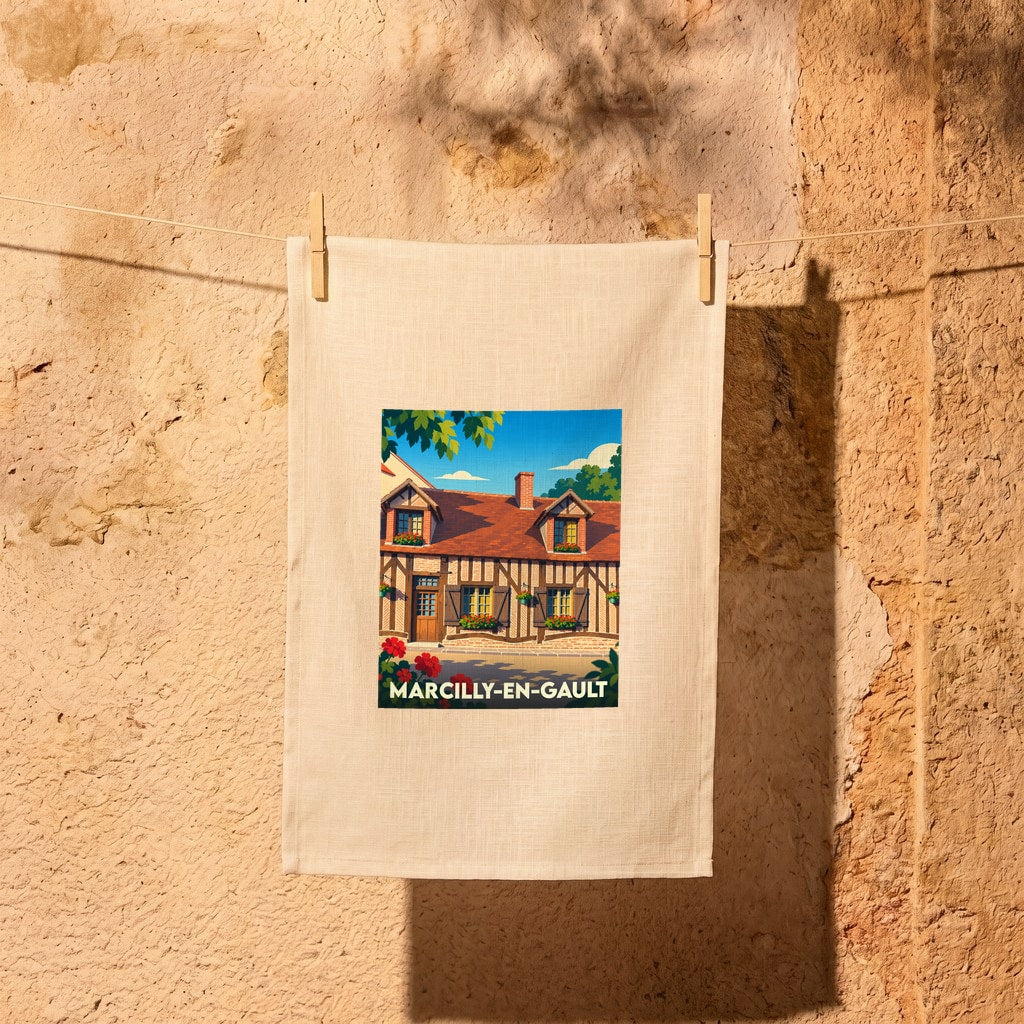 Torchon souvenir de Marcilly-en-Gault avec une illustration colorée d'une maison à colombages typique.