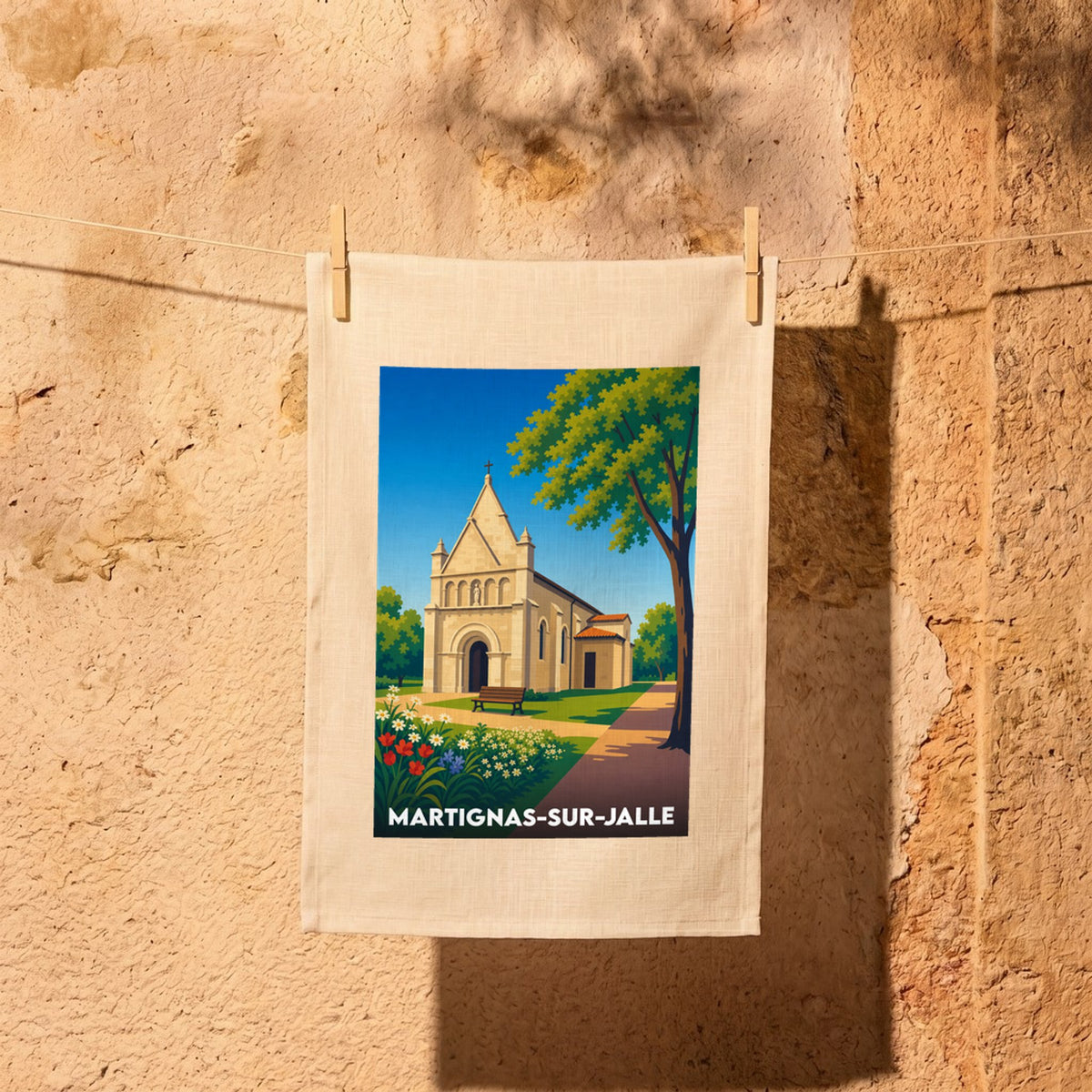 Torchon souvenir de la ville de Martignas-sur-Jalle avec une illustration stylisée de son église.