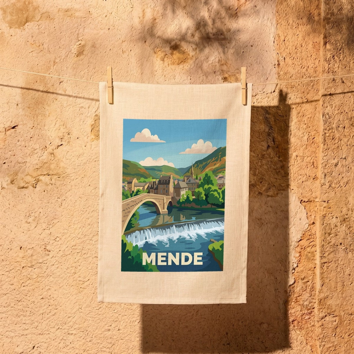 Torchon souvenir de la ville de Mende avec une illustration stylisée.