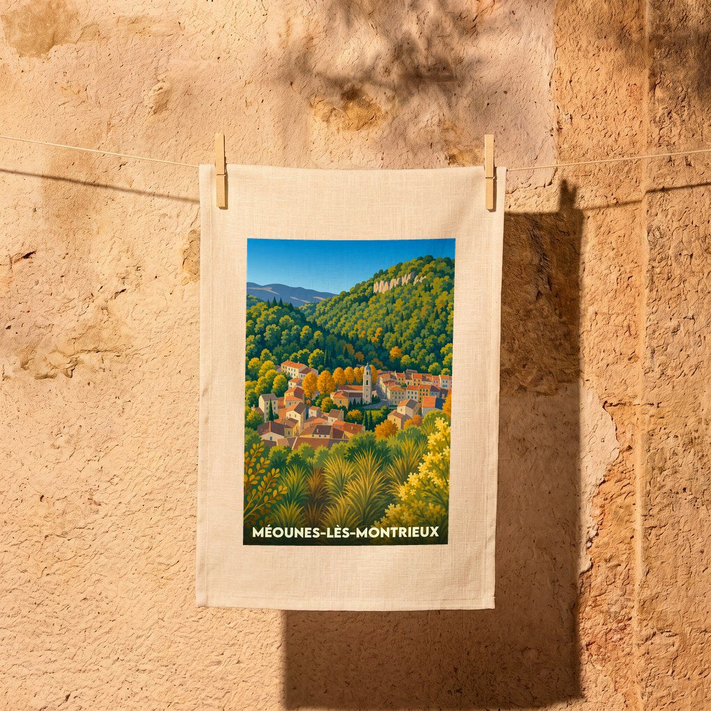 Torchon souvenir de Méounes-lès-Montrieux arborant une illustration stylisée du village niché dans une vallée verdoyante.