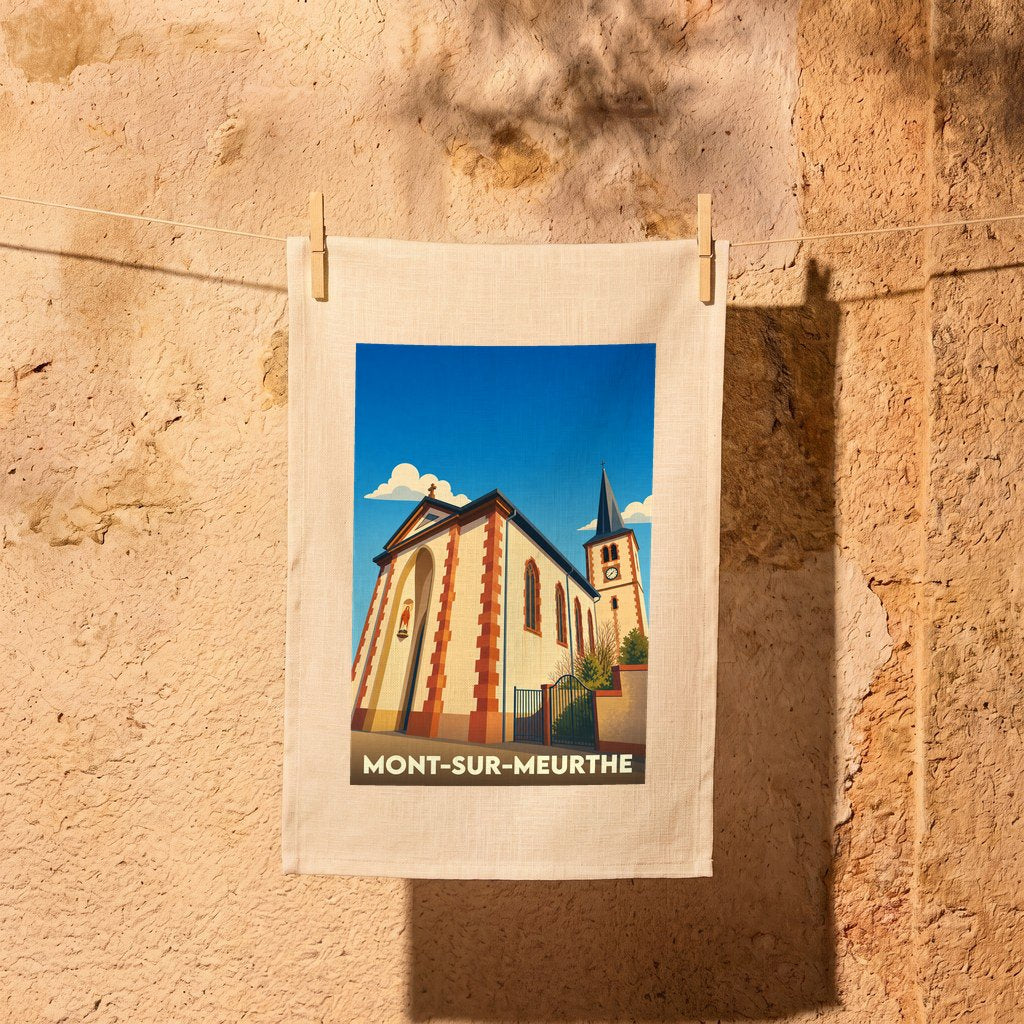 Torchon souvenir de la ville de Mont-sur-Meurthe illustré d'un dessin stylisé de son église.