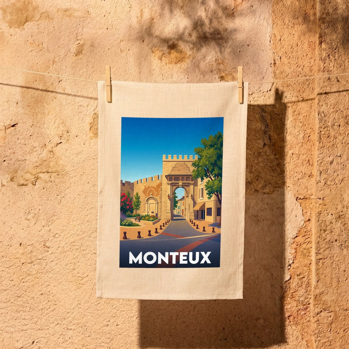 Torchon souvenir de la ville de Monteux avec une illustration stylisée.